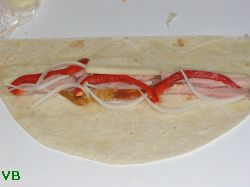 Tortilla with smoked chicken, cheese, onion and bell pepper